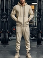 Detail of beige men's hooded fleece tracksuit with zipper and drawstring in a gym - S / Top And Bottom / Khaki