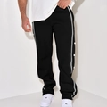 Detail of vintage black joggers featuring grey side stripes and functional white snap buttons - Black