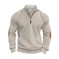 Detailed close-up of beige ribbed knit sweater with 1/4 zipper and brown elbow patches - Apricot