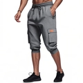 Detail of grey cargo shorts featuring heavy cotton fabric, side pockets and elastic drawstring - Dark Gray