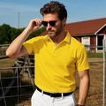 Men's bright yellow short sleeve polo shirt with striped collar trim in outdoor sunlight - Yellow