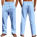 Dettaglio dei pantaloni in lino azzurro con vita elastica a coulisse e trama del tessuto - Azzurro