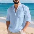 Detail of light blue linen henley shirt featuring a front pocket and small stand collar - Light Blue