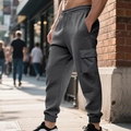 Macro shot of dark grey waffle texture fabric on men cargo jogger pants with side pocket - S / Bottoms / Dark Gray