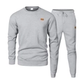 Close-up of men grey tracksuit featuring diamond texture and brown leather patch details - S / Top And Bottom / Light Gray