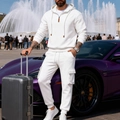 Detail of white half-zip hoodie and cargo pants set with leather zipper pull detail - S / Top And Bottom / White