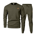 Detail of olive green athletic suit featuring geometric embossed texture and square leather patch - Army Green