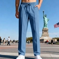 Detail of blue men's straight casual trousers with front pleats and drawstring waist - S / Denim Blue