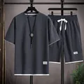 Completo uomo t-shirt e pantaloncini in maglia a nido d'ape grigio scuro con bordi bianchi - Taglia M / Top E Pantaloni / Grigio scuro