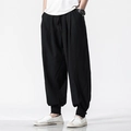 Linen harem pants for men with drawstring waist and buttoned cuffs in black - Black