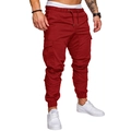 Detail view of deep red cargo joggers featuring elastic drawstring waist and side utility pockets - Burgundy