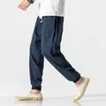 Men's dark blue linen harem pants with elastic drawstring waist and tapered ankle cuffs - Navy Blue