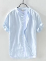 Detailed texture of light blue linen shirt featuring stand collar and button-down front - S / Tops / Light Blue