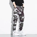 Detail of men's camouflage cargo pants with large side pockets and elastic cuffs - M / Camo Joggers / Camo White