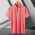 Detail of pink polo shirt collar with three black buttons on a wooden hanger - Bean Red