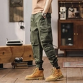 Olive green cargo pants with multi-pockets and cuffed ankles in military vintage style - EU 29 / Army Green