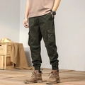 Detail view of cargo pants featuring utility flap pockets and durable canvas texture - EU 29 / Army Green