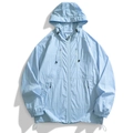 Close-up of light blue sun protection jacket with hood, dual chest zippers and nylon texture - Moonlight Blue
