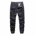 Detail of cargo pants showing camo pattern, flap pockets and ribbed jogger cuffs - Dark Blue