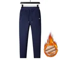 Detail view of navy blue men's fleece lined sweatpants with elastic waist and thermal interior - L / Blue Straight