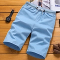 Men's light blue casual shorts with elastic drawstring waist on a wooden background - M / Sky Blue