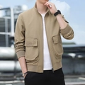 Men's khaki utility jacket with stand collar and large flap cargo pockets on model - M / Khaki