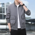 Men's grey outdoor functional jacket featuring large flap pockets and a stylish stand collar - M / Gray