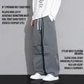 Men's dark grey cargo pants with wide-leg cut and knee flap details in street style - M / Green-Gray