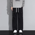 Pantaloni cargo parachute da uomo neri con cuciture a contrasto arancioni e vestibilità ampia - M / Nero