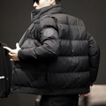 Men's heavy black winter puffer jacket with lion head sleeve badge and quilted design - M / Black