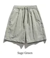 Detail of grey-green quick-dry shorts featuring elastic waist and mountain print logo - S / Gray