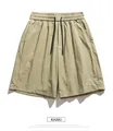 Detail of khaki quick-dry shorts featuring elastic waist and mountain embroidery - S / Khaki