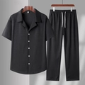 Men's summer casual two-piece set featuring textured black button-down shirt and drawstring pants - M / Black