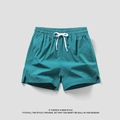 Dunkelgrüne schnell trocknende Herren-Sportshorts mit Gummizug und weißem Kordelzug - Seeblau