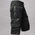 Men's loose black cotton cargo shorts with multiple zip pockets and metal D-ring details - S / Black