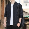 Men's black windproof bomber jacket with subtle camouflage pattern and ribbed trim - M / Black