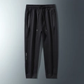 Men's black joggers with drawstring waist and geometric print on the leg, flat lay view - 3XL / Cuffed Leg / Black