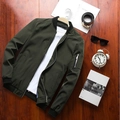 Men's olive green bomber jacket with black ribbed trim on a flat lay wooden background - 6XL / Army Green