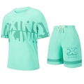 Close-up of mint green breathable mesh fabric on sport t-shirt and drawstring shorts set - XS / Top And Bottom / Green