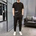 Set sportivo da uomo in seta ghiacciata nera con maglietta a maniche corte e pantaloni - M / Nero