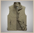 Close-up of olive green outdoor vest featuring zipper pockets and breathable mesh lining - S / Tops / Khaki