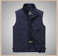 Detail of outdoor vest with breathable blue mesh lining and multiple zipper pockets - S / Tops / Dark Blue