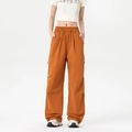 Orange loose cargo pants with drawstring waist and large utility side pockets - S / Sunset Orange