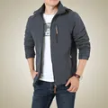 Men's dark grey hooded outdoor cargo jacket with fleece lining and adjustable cuffs - M / Gray