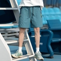 Relaxte blauwe sneldrogende cargo shorts met neongele ritsen en een elastische taille - M / Meerblauw