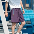 Men's purple sport shorts with elastic drawstring waist and blue zip pocket detail - M / Wilderness Purple