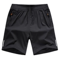 Dettaglio dei pantaloncini neri da uomo con tasca con cerniera arancione e coulisse in vita - M / Nero