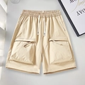 Flat lay of khaki utility cargo shorts with elastic drawstring waist and large side pockets - S / Khaki