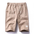 Men's drawstring cargo shorts in khaki cotton fabric with elastic waist and side pockets - Khaki