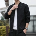 Veste noire pour homme avec col baseball et texture discrète pour un look décontracté - M / Bleu Noir